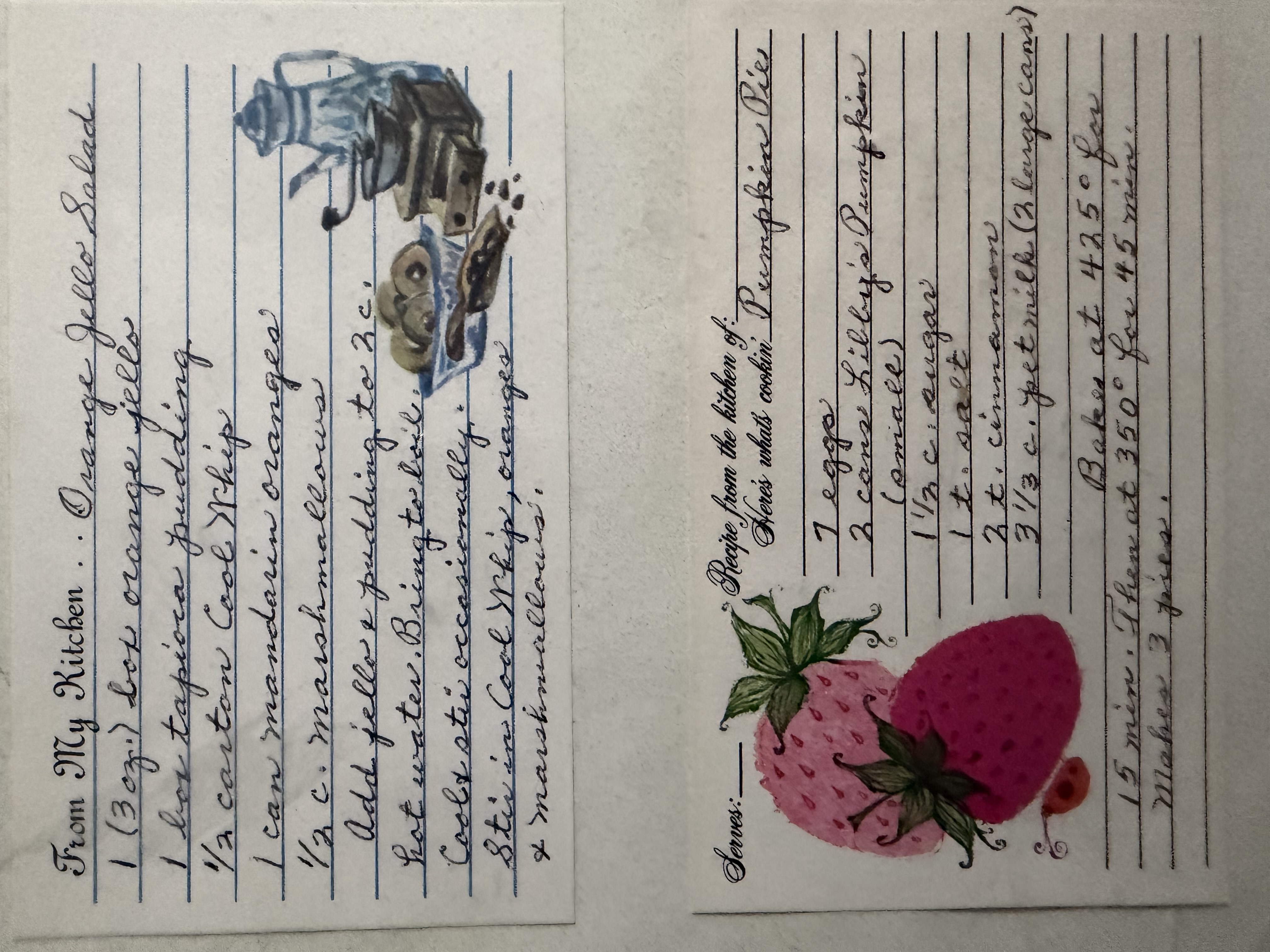 Two handwritten recipe cards from Elizabeth's kitchen — Orange Jello Salad and a Pumpkin Pie, in her handwriting